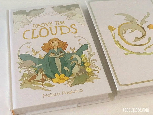 Book titled 'Above the Clouds' with illustrations on a white background