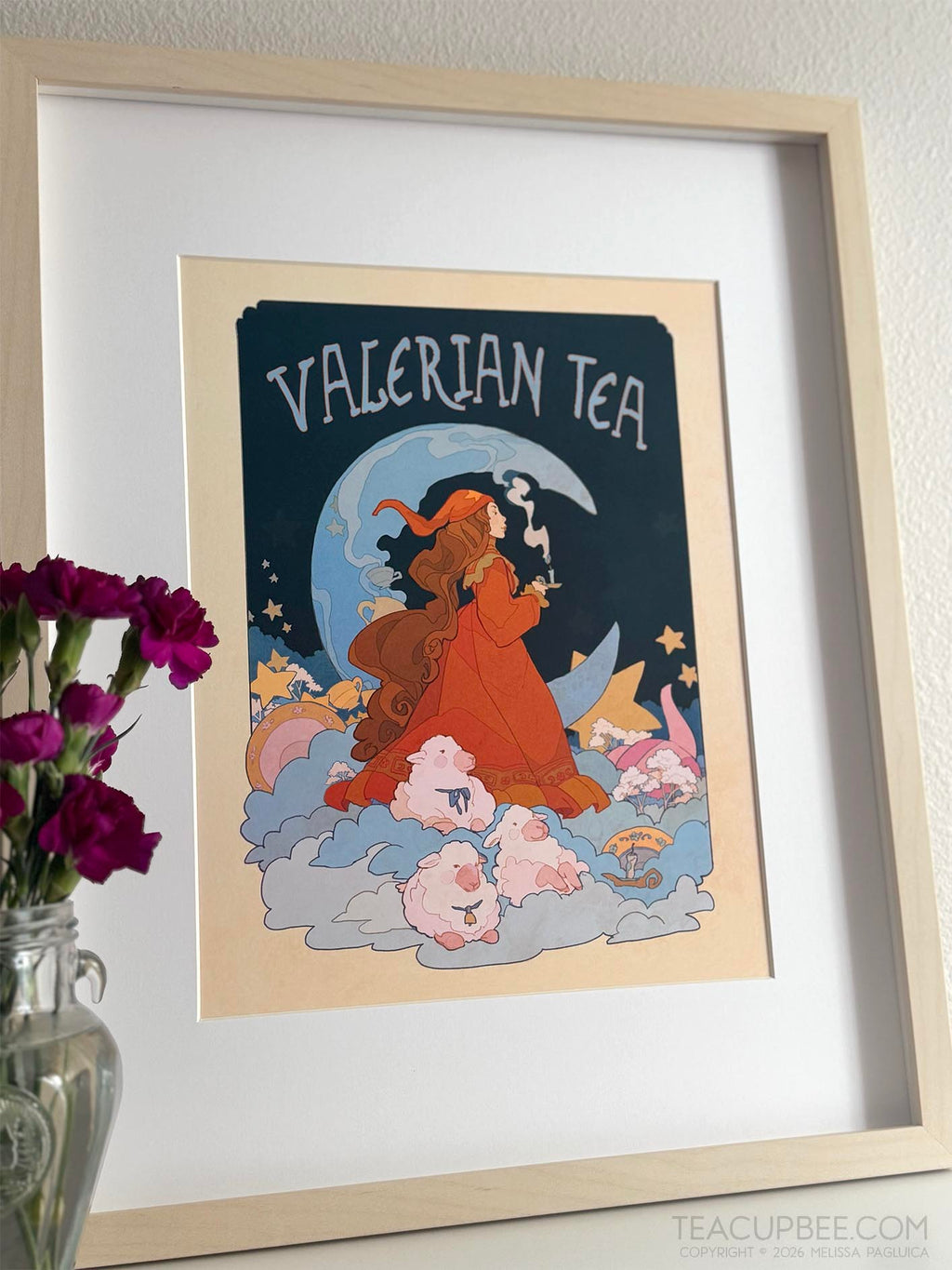 Framed artwork of a woman in a red dress with 'Valerian Tea' text against a night sky.